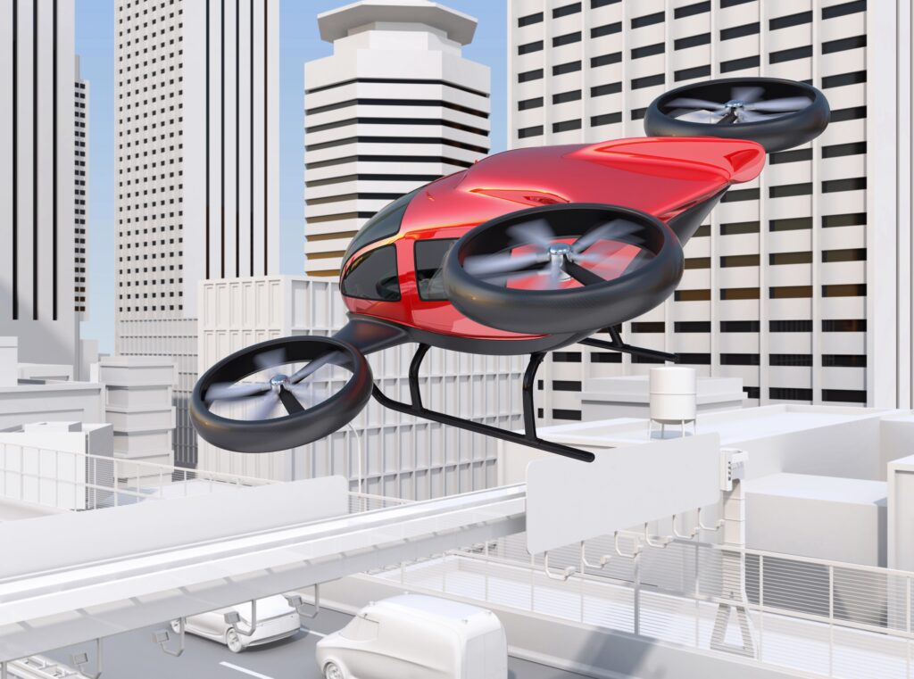都市上空を飛行する有人ドローンのイメージ